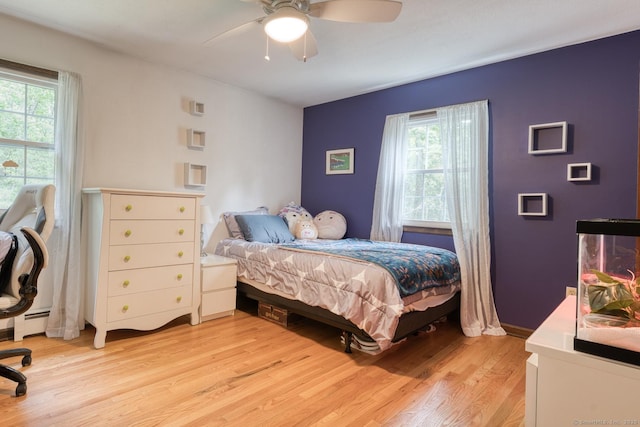24 Marbella Ln, Tolland, CT 06084 - bedroom with light wood-type flooring and a ceiling fan
