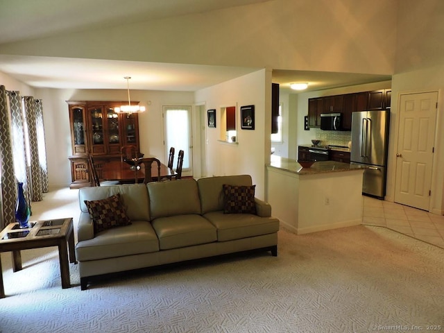 2 Abbewood Dr Unit 2, Enfield, CT 06082 - living room featuring a chandelier, lofted ceiling, and light colored carpet