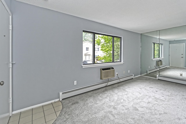 60 Plainfield Ave Unit 14, West Haven, CT 06516 - unfurnished bedroom with a baseboard radiator, a textured ceiling, an AC wall unit, baseboards, and carpet flooring