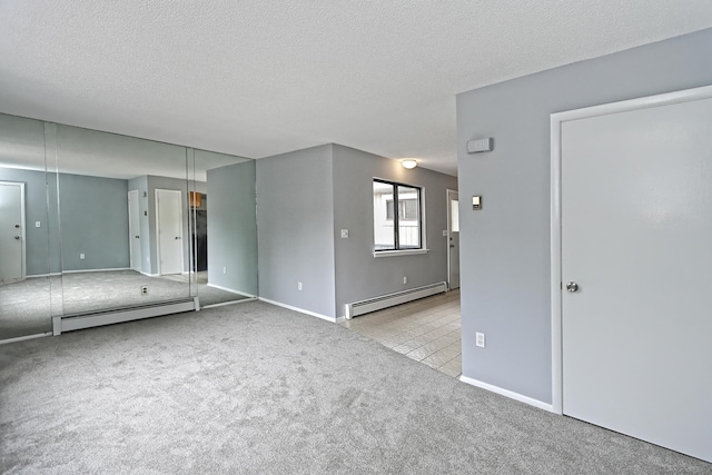 60 Plainfield Ave Unit 14, West Haven, CT 06516 - unfurnished bedroom with a baseboard heating unit, carpet, baseboards, a textured ceiling, and tile patterned flooring