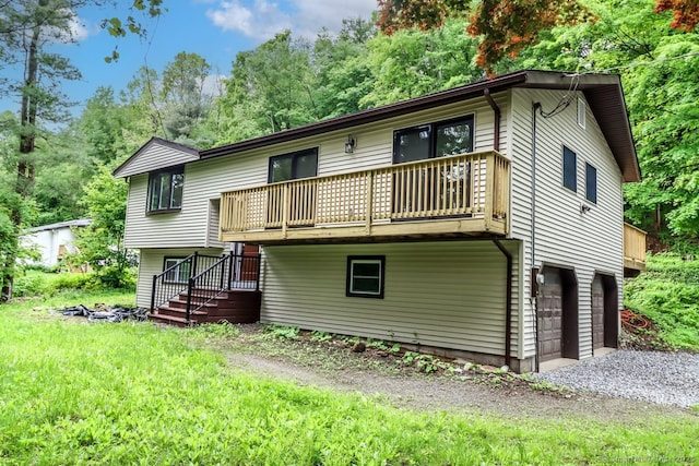 4 Deer Run Trl, Sherman, CT 06784 - back of house featuring a balcony, an attached garage, driveway, and view of scattered trees