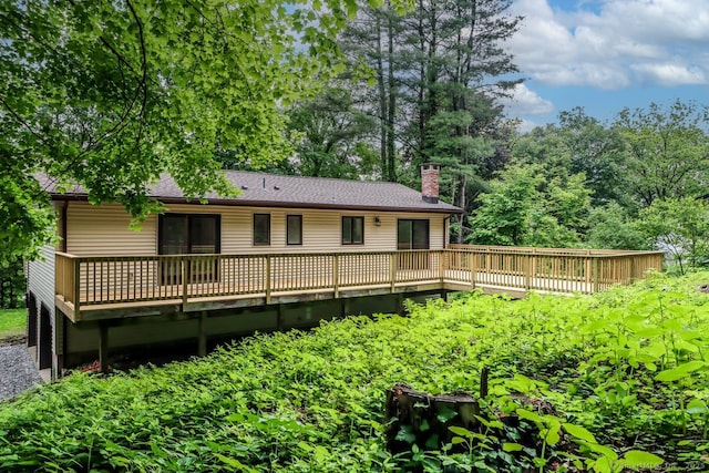 4 Deer Run Trl, Sherman, CT 06784 - rear view of house with a deck, a chimney, and a shingled roof