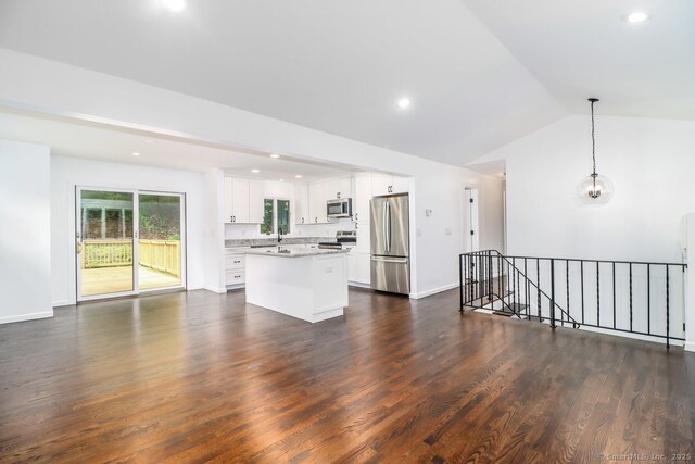 4 Deer Run Trl, Sherman, CT 06784 - unfurnished living room featuring dark wood-type flooring, lofted ceiling, and recessed lighting