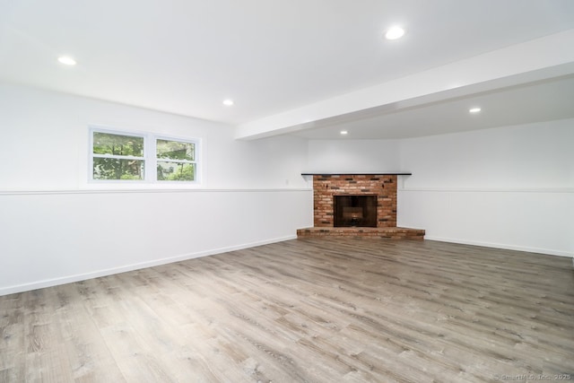 4 Deer Run Trl, Sherman, CT 06784 - unfurnished living room with wood finished floors, recessed lighting, a brick fireplace, and baseboards