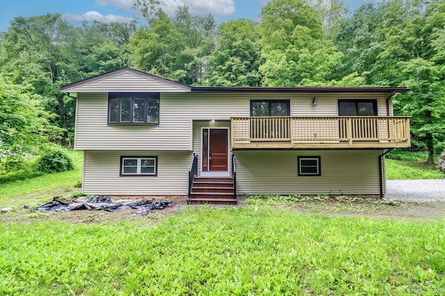 4 Deer Run Trl, Sherman, CT 06784 - view of front facade with entry steps, a balcony, a front lawn, and a view of trees