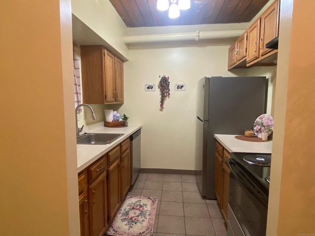 839 Main St Apt 35, Torrington, CT 06790 - kitchen with black range, dishwasher, a sink, light countertops, and baseboards