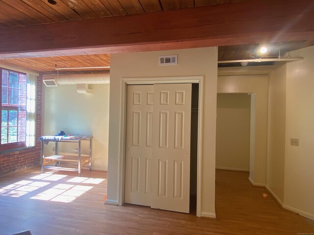 839 Main St Apt 35, Torrington, CT 06790 - hall featuring wood finished floors, wooden ceiling with exposed beams, and baseboards