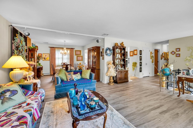 27 N Rd, Waterford, CT 06385 - living room featuring a chandelier, wood finished floors, and baseboard heating