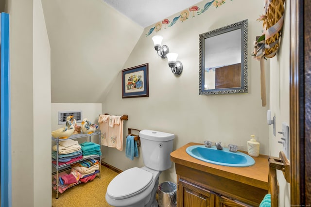 27 N Rd, Waterford, CT 06385 - bathroom featuring toilet, vaulted ceiling, and vanity