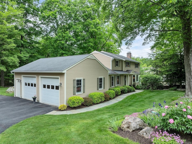 67 Great Hill Rd, Ridgefield, CT 06877 - traditional home with a chimney, a shingled roof, a front yard, and a detached garage