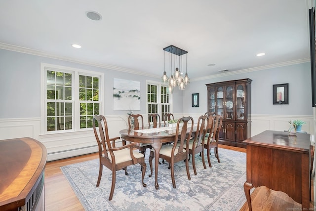 67 Great Hill Rd, Ridgefield, CT 06877 - dining room with a chandelier, wainscoting, light wood-type flooring, crown molding, and a baseboard heating unit