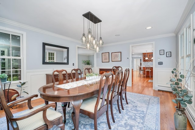 67 Great Hill Rd, Ridgefield, CT 06877 - dining room featuring a wainscoted wall, light wood-style flooring, ornamental molding, a baseboard radiator, and a chandelier