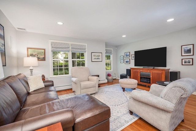 67 Great Hill Rd, Ridgefield, CT 06877 - living area with baseboard heating, recessed lighting, and wood finished floors