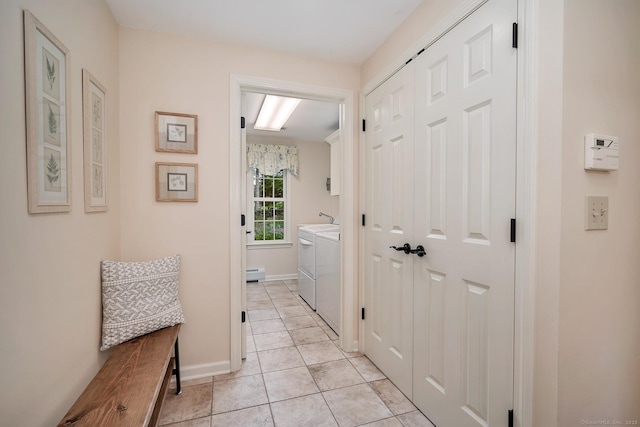 67 Great Hill Rd, Ridgefield, CT 06877 - hallway featuring washing machine and clothes dryer, baseboards, and light tile patterned floors