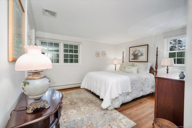 67 Great Hill Rd, Ridgefield, CT 06877 - bedroom featuring wood finished floors and a baseboard heating unit