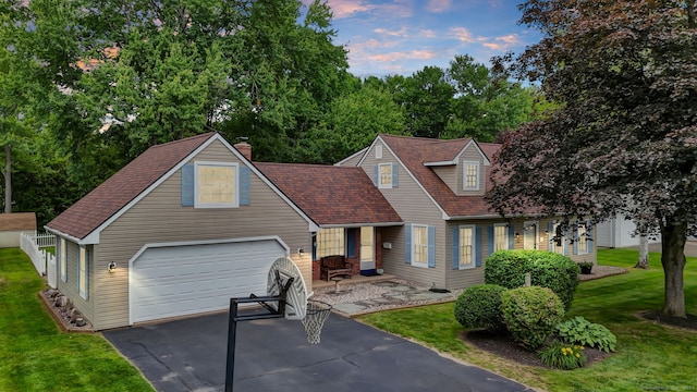 47 Edrow Rd, Bristol, CT 06010 - view of front facade with driveway, a garage, a yard, and a shingled roof