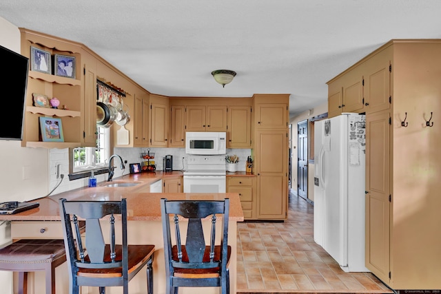 47 Edrow Rd, Bristol, CT 06010 - kitchen featuring white appliances, a peninsula, tasteful backsplash, light countertops, and a breakfast bar
