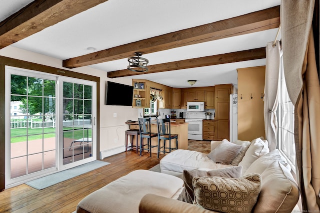 47 Edrow Rd, Bristol, CT 06010 - living room with beam ceiling, light wood finished floors, and a baseboard heating unit