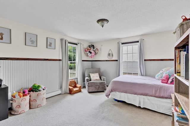 47 Edrow Rd, Bristol, CT 06010 - carpeted bedroom with a baseboard heating unit and a textured ceiling