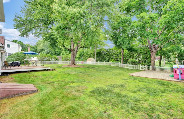47 Edrow Rd, Bristol, CT 06010 - fenced backyard featuring a deck and view of wooded area
