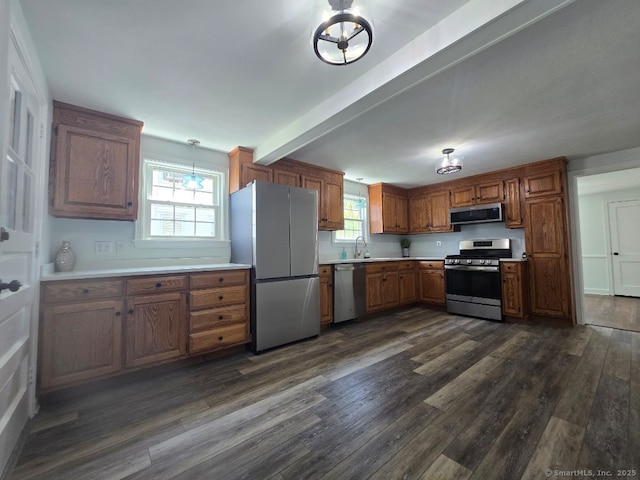 28 S Highland St, West Hartford, CT 06119 - kitchen with stainless steel appliances, a sink, dark wood-style flooring, light countertops, and plenty of natural light