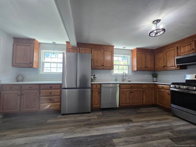 28 S Highland St, West Hartford, CT 06119 - kitchen with stainless steel appliances, brown cabinets, light countertops, and dark wood-style floors