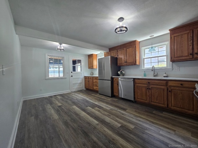 28 S Highland St, West Hartford, CT 06119 - kitchen with stainless steel appliances, a sink, dark wood-style floors, and light countertops