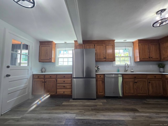 28 S Highland St, West Hartford, CT 06119 - kitchen with appliances with stainless steel finishes, brown cabinets, dark wood-style flooring, and healthy amount of natural light