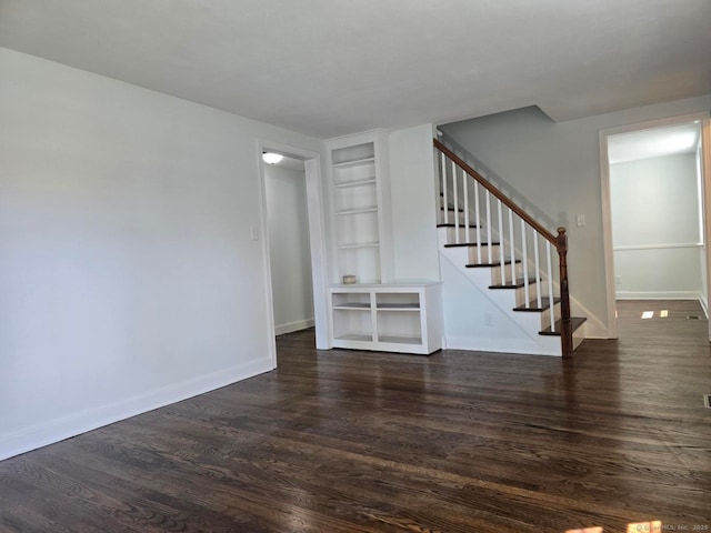 28 S Highland St, West Hartford, CT 06119 - unfurnished living room featuring built in features, stairway, baseboards, and dark wood-style floors