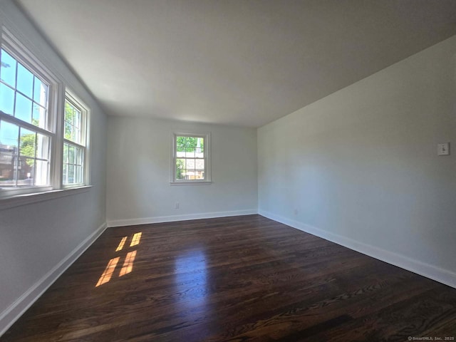 28 S Highland St, West Hartford, CT 06119 - empty room with dark wood-style flooring and baseboards