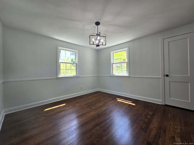 28 S Highland St, West Hartford, CT 06119 - spare room with a chandelier, dark wood finished floors, and baseboards
