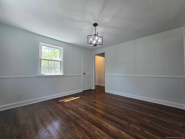 28 S Highland St, West Hartford, CT 06119 - spare room featuring a chandelier, dark wood-style floors, and baseboards