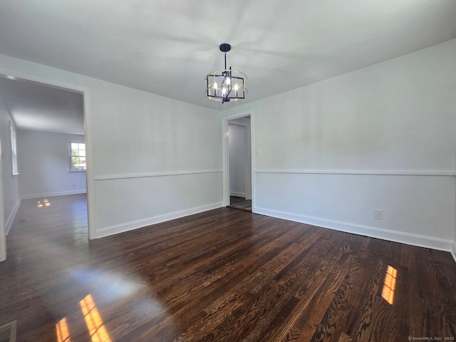 28 S Highland St, West Hartford, CT 06119 - empty room featuring a chandelier, baseboards, and dark wood-type flooring