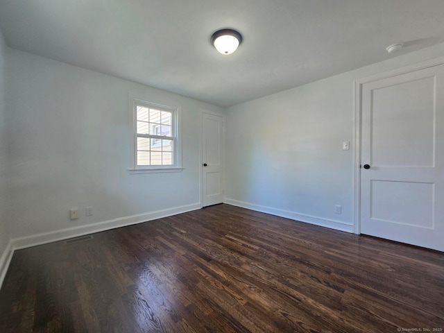 28 S Highland St, West Hartford, CT 06119 - unfurnished room featuring dark wood-type flooring, baseboards, and a smoke detector