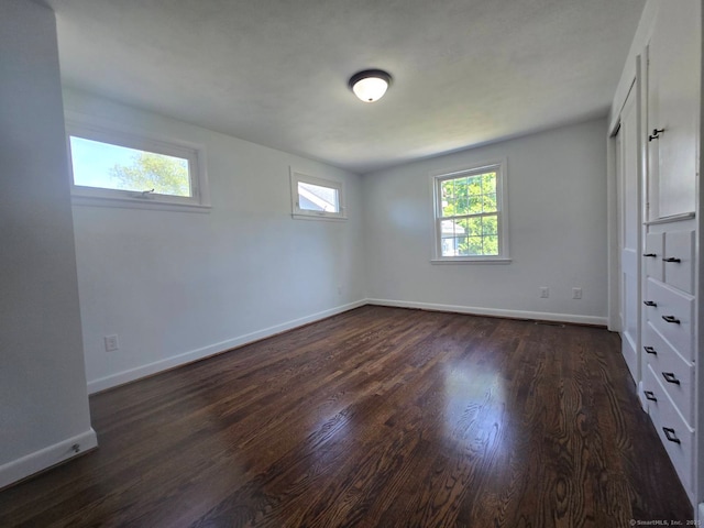 28 S Highland St, West Hartford, CT 06119 - unfurnished bedroom featuring dark wood-style floors and baseboards