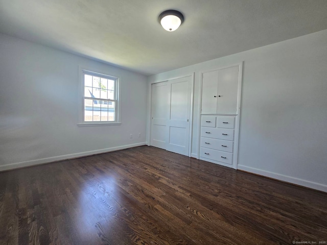 28 S Highland St, West Hartford, CT 06119 - unfurnished bedroom with dark wood-style floors and baseboards
