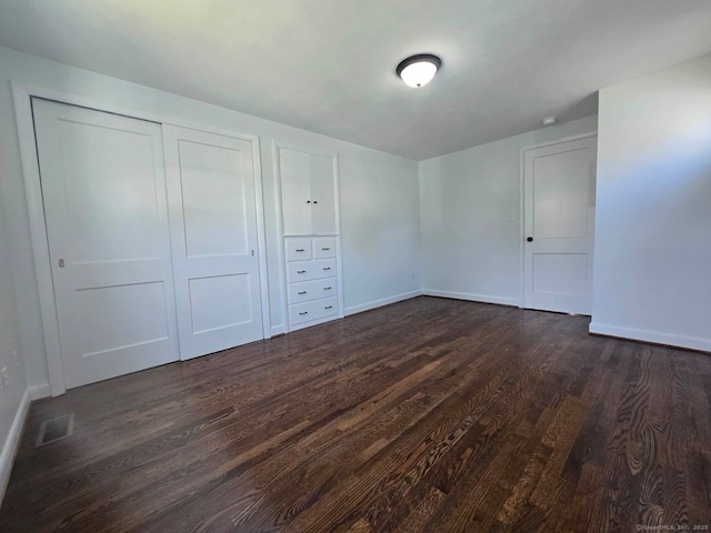 28 S Highland St, West Hartford, CT 06119 - unfurnished bedroom with dark wood-style floors, baseboards, and a closet
