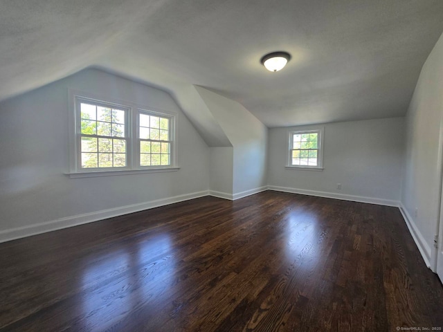 28 S Highland St, West Hartford, CT 06119 - additional living space featuring dark wood-type flooring, lofted ceiling, and baseboards