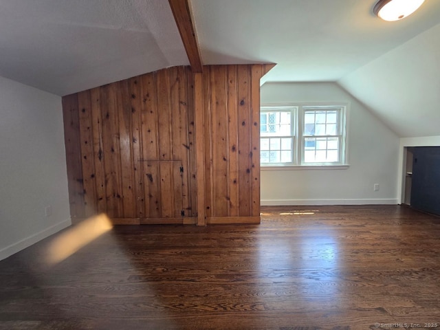 28 S Highland St, West Hartford, CT 06119 - bonus room with vaulted ceiling, dark wood-style floors, baseboards, and wood walls