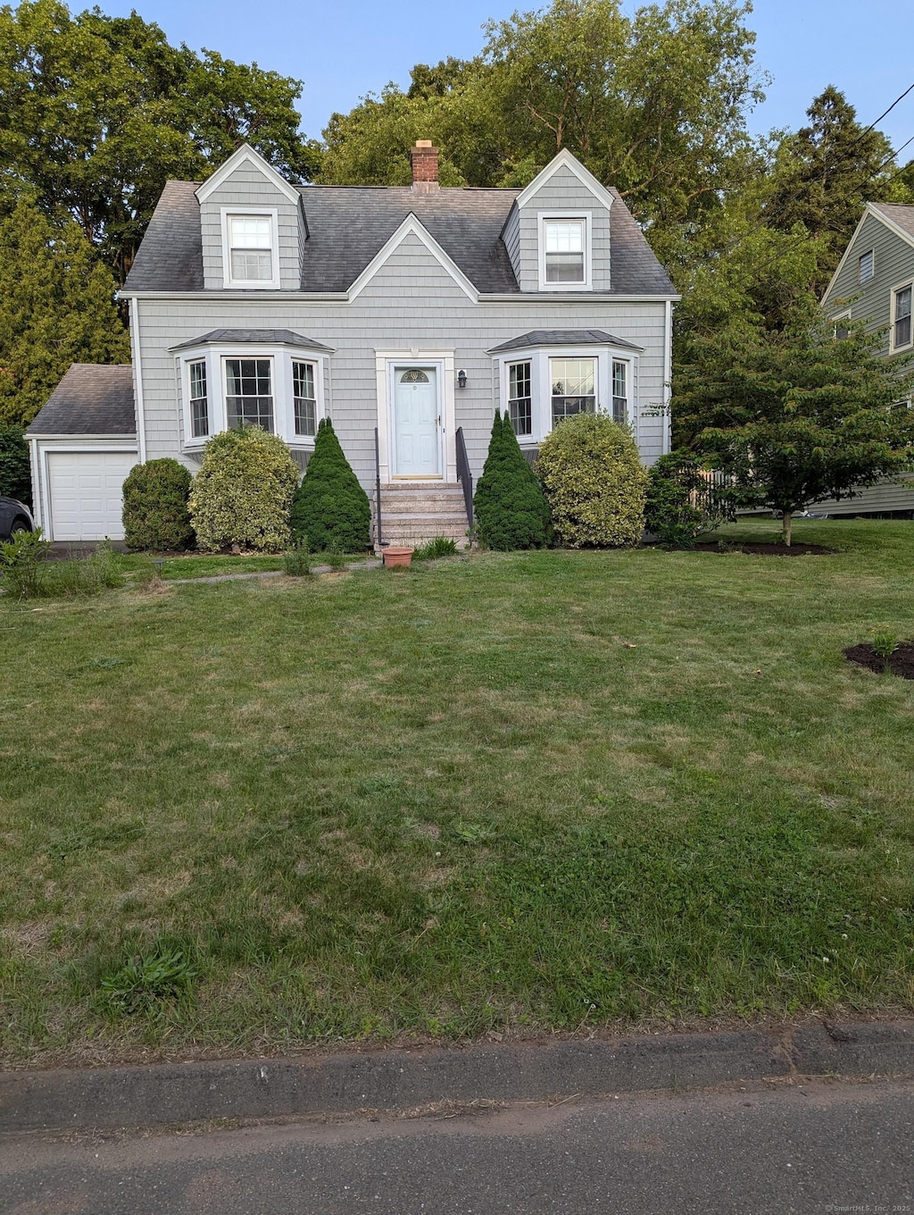 20 Van Rose Dr, North Haven, CT 06473 - cape cod home featuring a front yard, a chimney, and roof with shingles