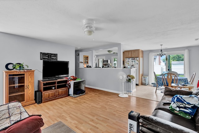 28 Kulper Rd, New Britain, CT 06051 - living room featuring ceiling fan, light wood-style floors, a chandelier, and baseboards