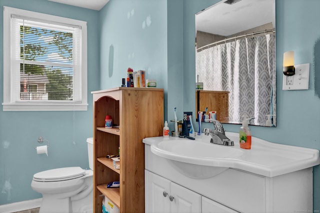 28 Kulper Rd, New Britain, CT 06051 - bathroom with vanity, toilet, baseboards, and a shower with shower curtain