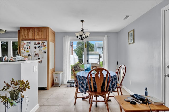 28 Kulper Rd, New Britain, CT 06051 - dining space featuring a chandelier, baseboards, and light tile patterned floors