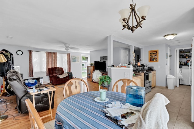 28 Kulper Rd, New Britain, CT 06051 - dining area featuring light tile patterned floors, a chandelier, and a ceiling fan