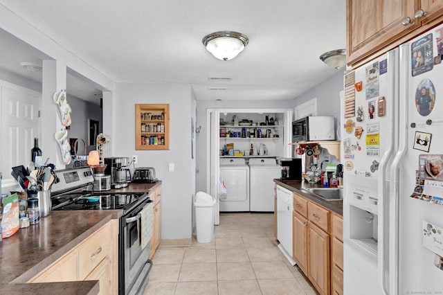 28 Kulper Rd, New Britain, CT 06051 - kitchen featuring white appliances, washer and clothes dryer, dark countertops, and light tile patterned flooring
