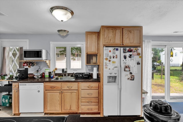 28 Kulper Rd, New Britain, CT 06051 - kitchen featuring white appliances, a sink, and dark countertops
