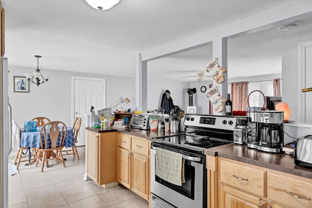 28 Kulper Rd, New Britain, CT 06051 - kitchen featuring stainless steel electric range oven, dark countertops, a chandelier, light tile patterned floors, and freestanding refrigerator