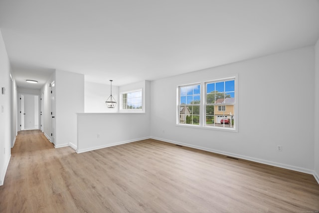 23 Shadybrook Ln, Waterbury, CT 06706 - empty room with light wood-style floors and baseboards