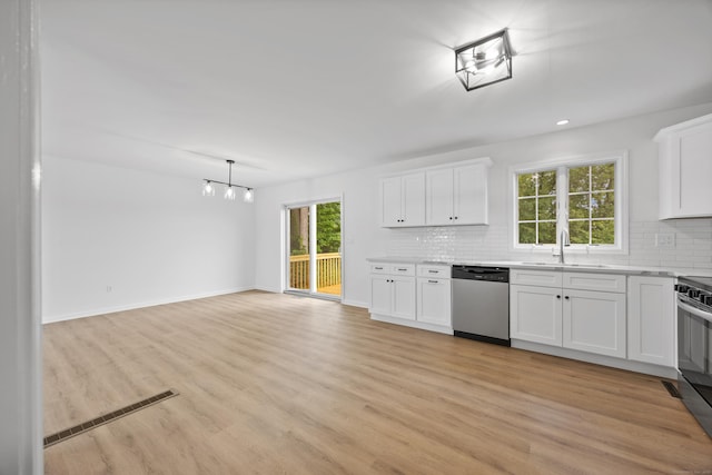 23 Shadybrook Ln, Waterbury, CT 06706 - kitchen featuring appliances with stainless steel finishes, tasteful backsplash, white cabinets, light wood finished floors, and recessed lighting