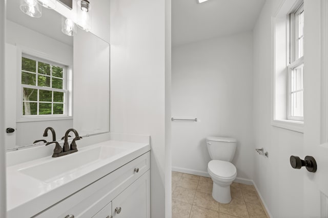 23 Shadybrook Ln, Waterbury, CT 06706 - half bathroom featuring healthy amount of natural light, vanity, and tile patterned flooring